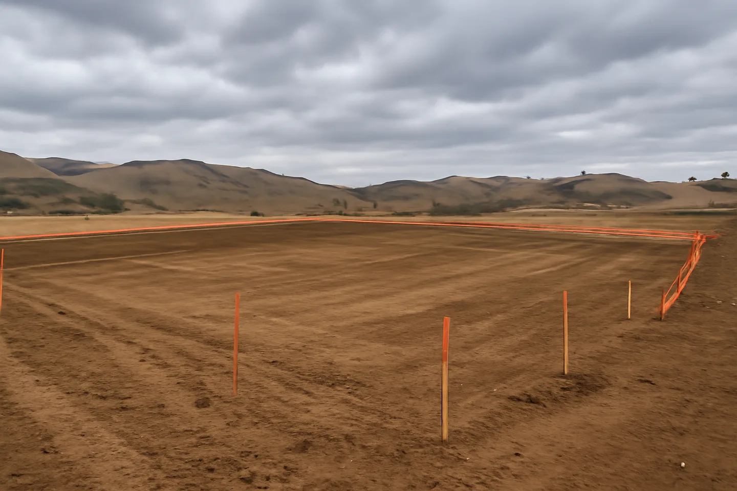 Graded construction lot with utility stakes
